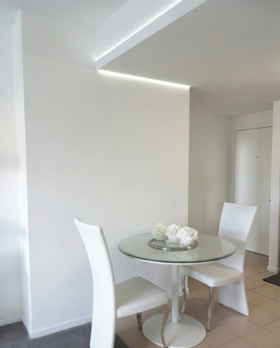 Blank white dining area wall before the geometric mural